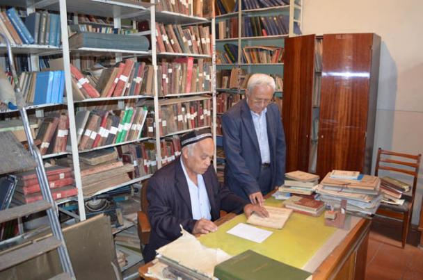 The manuscript collection section of the Kokand Literary Museum. Dr Abdulatif Turdialiev, Museum Director (r)