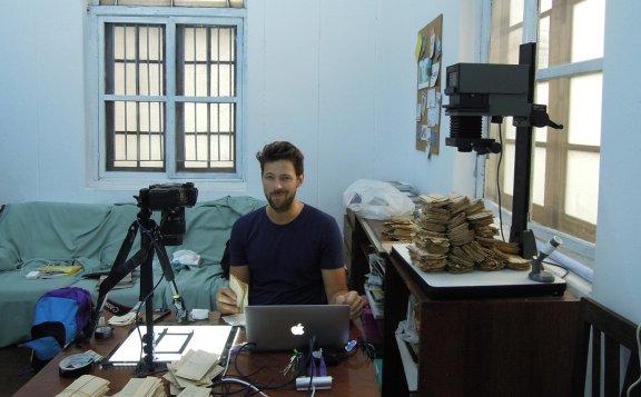 Lukas digitising negatives at the Myanmar Art Resource Center and Archive (MARCA) office, Yangon