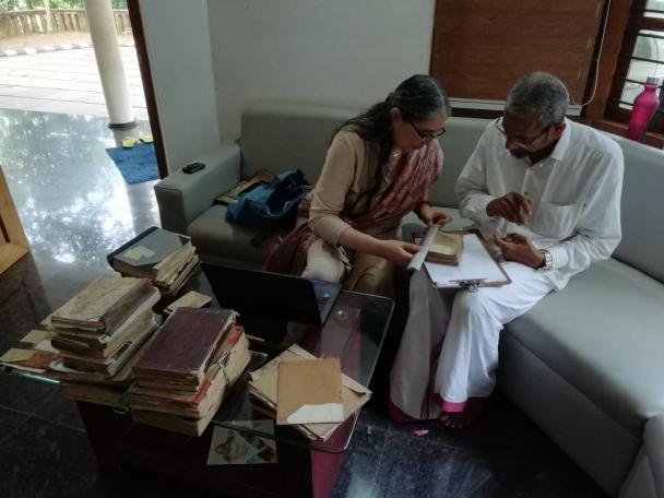 Dr Gamliel surveying manuscripts with Abdussalam Musaliyarakath Safiya, a descendant of the famous Makhdum family and owner of a manuscripts collection (Photo: Dr Ajmal Mueen Kodiyathur)
